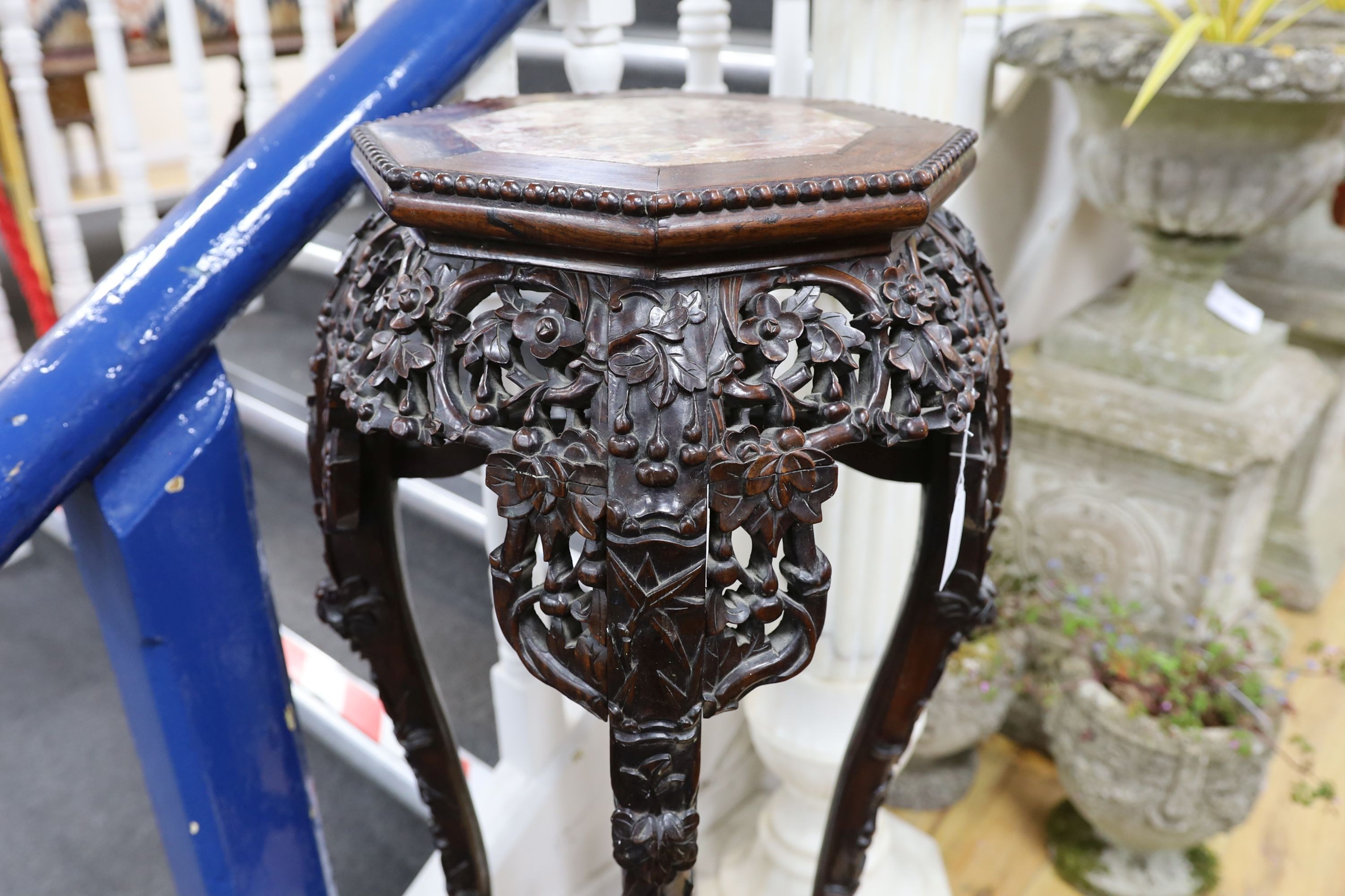 A Chinese hongmu marble topped jardiniere stand, early 20th century, height 90cm